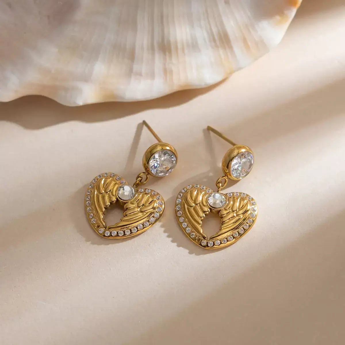 wings of love earrings, heart wings earrings, gold heart earrings, wing heart earrings for women, 18k gold plated heart earrings, zircon heart earrings, stainless steel gold earrings, minimalist gold earrings, delicate gold earrings, hypoallergenic gold earrings, romantic earrings gift, jewellery gift for her, valentines day earrings