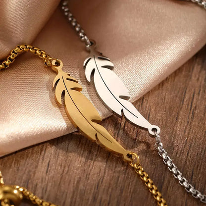 feather bracelete,

women’s bracelet,

stainless steel bracelete,

feather charm bracelete,

gold feather bracelet,

silver feather bracelete,

adjustable women’s bracelet,

minimalist bracelet for women