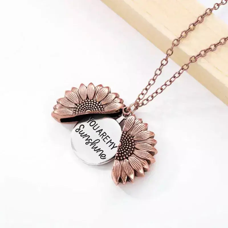 You Are My Sunshine – Sunflower Pendant Necklace,sunflower necklace, sunflower pendant, daisy chain necklace, floral pendant jewellery, friendship necklace, gift for best friend, meaningful necklace, engraved locket necklace, gift for her, sentimental gift for girlfriend, birthday gift for best friend, jewellery for loved ones, personalised necklace UK, heart necklace for her, boho necklace, bohemian jewellery, delicate pendant necklace, stainless steel necklace, everyday jewellery UK