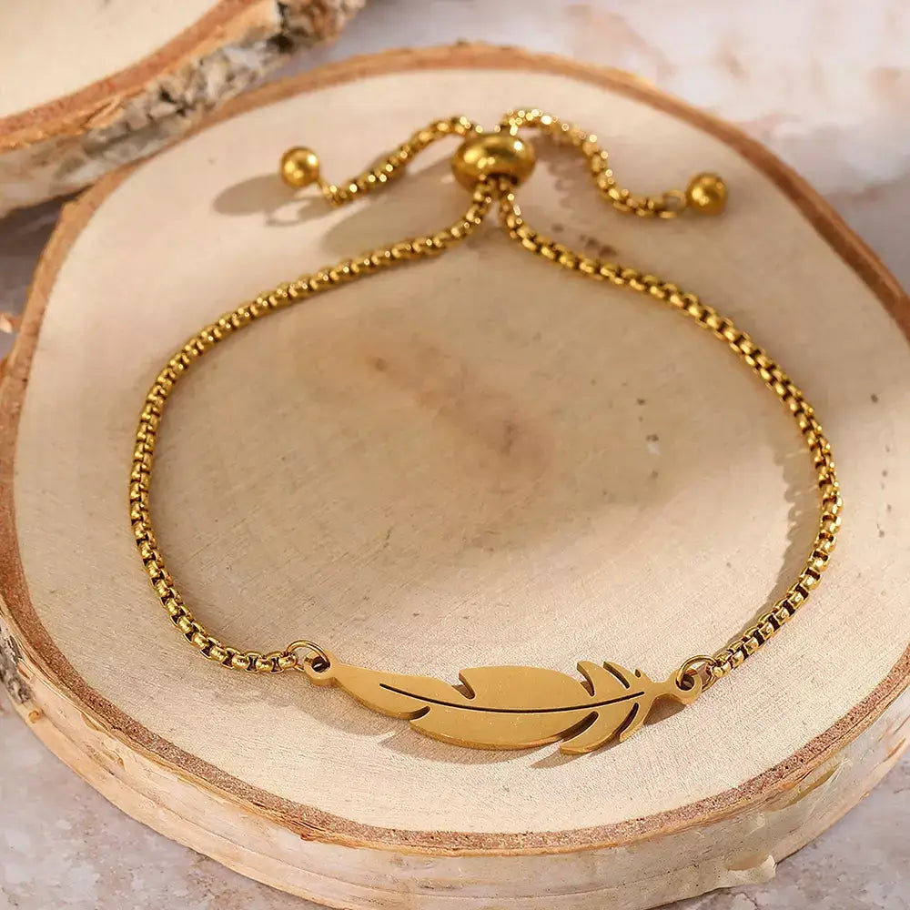 feather bracelete,

women’s bracelet,

stainless steel bracelete,

feather charm bracelete,

gold feather bracelet,

silver feather bracelete,

adjustable women’s bracelet,

minimalist bracelet for women