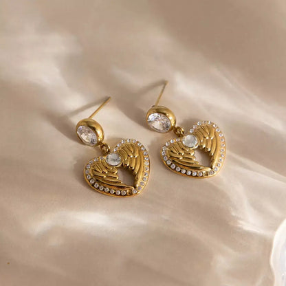 wings of love earrings, heart wings earrings, gold heart earrings, wing heart earrings for women, 18k gold plated heart earrings, zircon heart earrings, stainless steel gold earrings, minimalist gold earrings, delicate gold earrings, hypoallergenic gold earrings, romantic earrings gift, jewellery gift for her, valentines day earrings